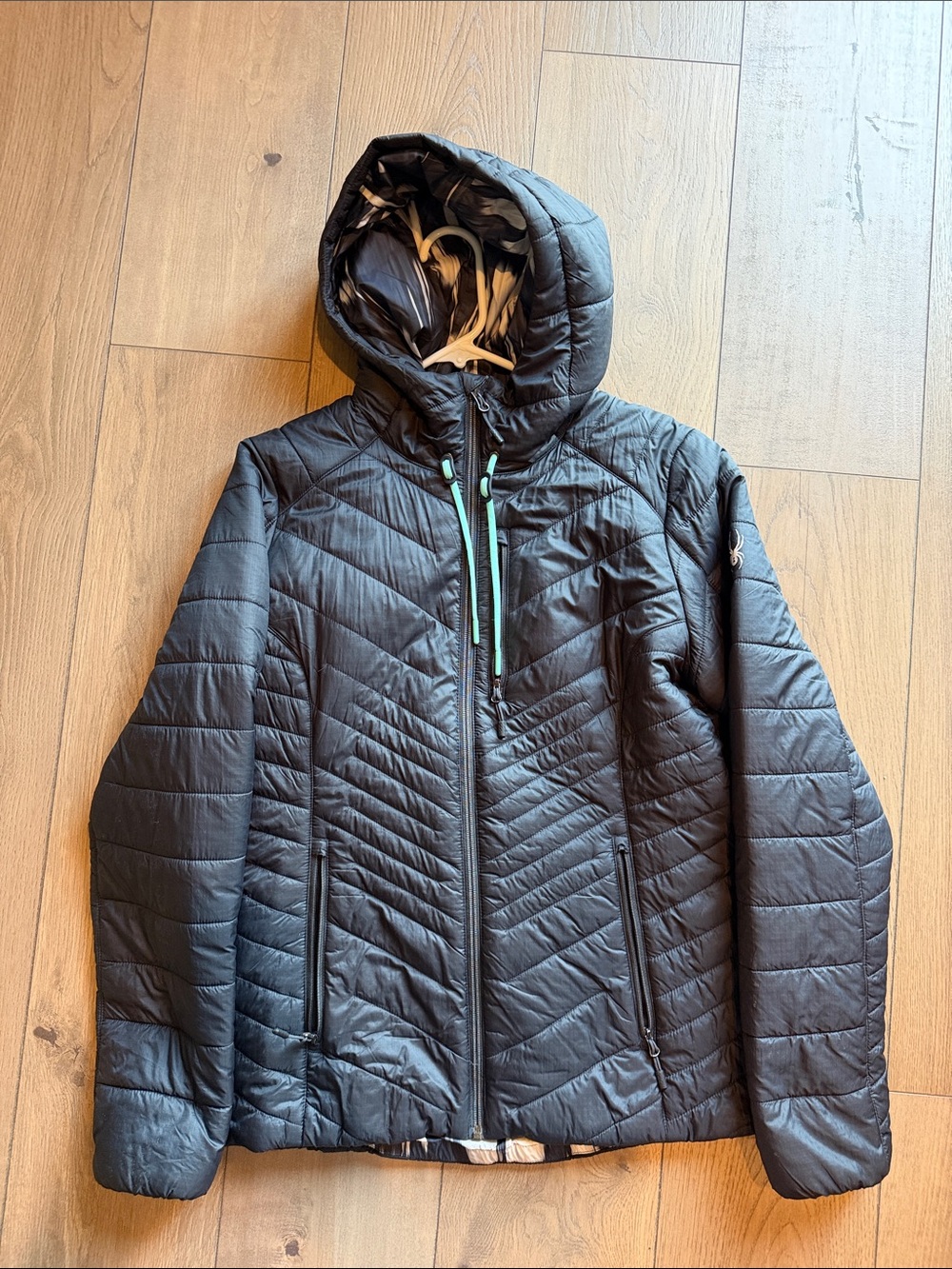 Spyder Women’s Black Quilted Hooded Puffer with Mint Zip Details